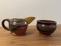 cream pitcher and sugar bowl side view