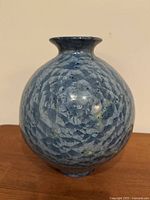 Full view of bulbous blue crystalline glaze vase