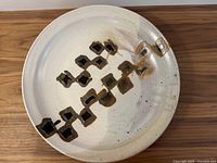 Top view of large shallow pottery bowl showing decorative glaze pattern