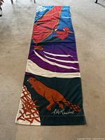 Full view of entire banner laid flat showing windsurfer and beaver graphics