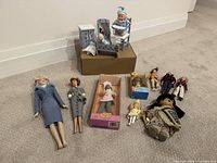 Group shot of all dolls and furniture