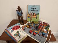 All items overview—figurine, books, canvas bag