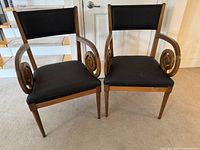 Both custom wood chairs framed, showing overall design