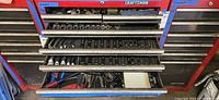 View of all six open drawers showing sockets, wrenches, tools