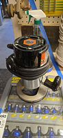 Router motor atop bit set case showing overall lot