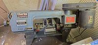 Left side view of Clarke Metalworker BT1015A bandsaw showing motor, frame and controls