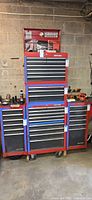 Front view of full stacked Craftsman tool cabinet system showing five pieces and shelf