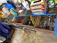 Row of six open drawers showing variety of hand tools