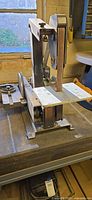 Full side view of Sears 1-inch sander/grinder on bench