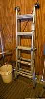Werner aluminum ladder folded, rubber feet visible