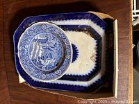 Top view of platter and plate inside box showing color, shape, wear