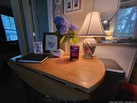 Table with one leaf down, accessories on top