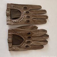 top view of both gloves showing perforations and snap closures