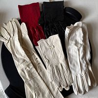 all five glove pairs displayed on surface