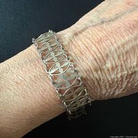 Bracelet worn on wrist showing scale and design detail