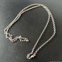 Full view of sterling silver link chain laid flat