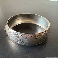 Full view of etched sterling silver hinged bangle