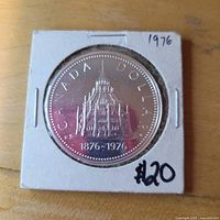 Reverse of 1976 Canadian silver dollar showing Library of Parliament design in 2×2 holder