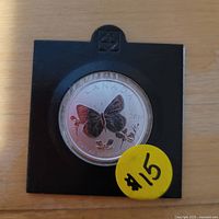 Reverse showing colourized butterfly design in 2×2 holder