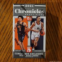 Front of sealed 2021 Panini Chronicles Draft Picks Basketball Cereal Box showing players and 25 card count