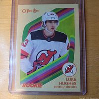 Front of Luke Hughes rookie card in plastic holder