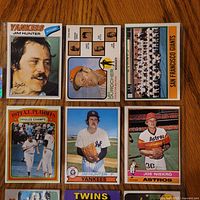 Fronts of nine vintage baseball cards laid out on table