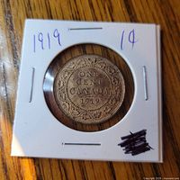 Reverse of 1919 Canadian one cent coin in holder