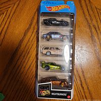 Front of sealed Hot Wheels Nightburnerz 5-pack showing all five cars