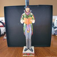 Front view of Jim Shore male caroler figurine