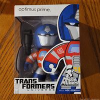 Front view of boxed Optimus Prime Mighty Muggs figure