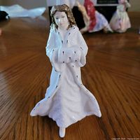 Front view of Royal Doulton Christmas Day figurine