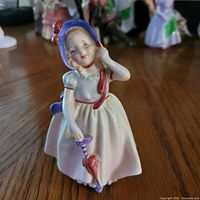 Front view of Babie figurine showing pose and colours