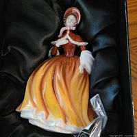Front view of Royal Doulton Autumn Joy figurine in box