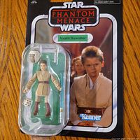 Front of sealed carded figure showing Anakin and accessories