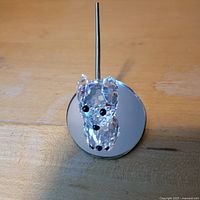 Front view of Swarovski crystal mouse on mirror base with metal rod
