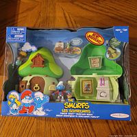 Front view of boxed Smurfs Painter Smurf Mushroom House playset showing house and figure