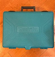 Closed teal Makita carrying case
