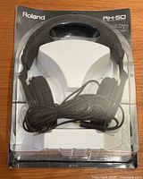 Front view of sealed Roland RH-50 headphones in retail packaging