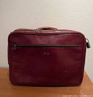 Front view showing H.G. monogram, front pocket, overall condition