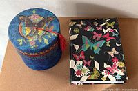 Container and notebook side by side for scale and overall view