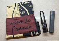 Apron folded with Aerolatte frother stand and case