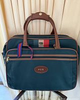 Front view showing bag, handles, front pocket, PCG patch