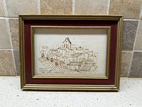 Full view of framed sketch with mat and frame visible