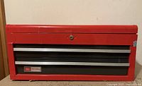 Front view of closed red Craftsman toolbox