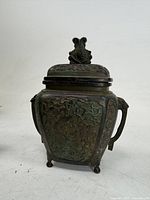 Front view of bronze censer with lid and finial