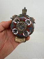 Front view showing cloisonné colors, jade edge, dragon medallion and characters