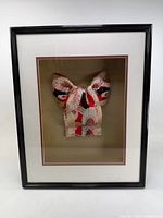 Framed kimono sash in shadow box with black wood frame
