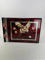 Front view of lacquered photo album with shell eagle and inlay