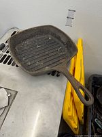 Top view of square ridged cast iron Emeril pan showing interior condition