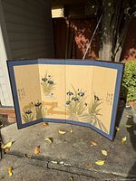Full view of three-panel folding screen showing entire painted scene, borders and frame